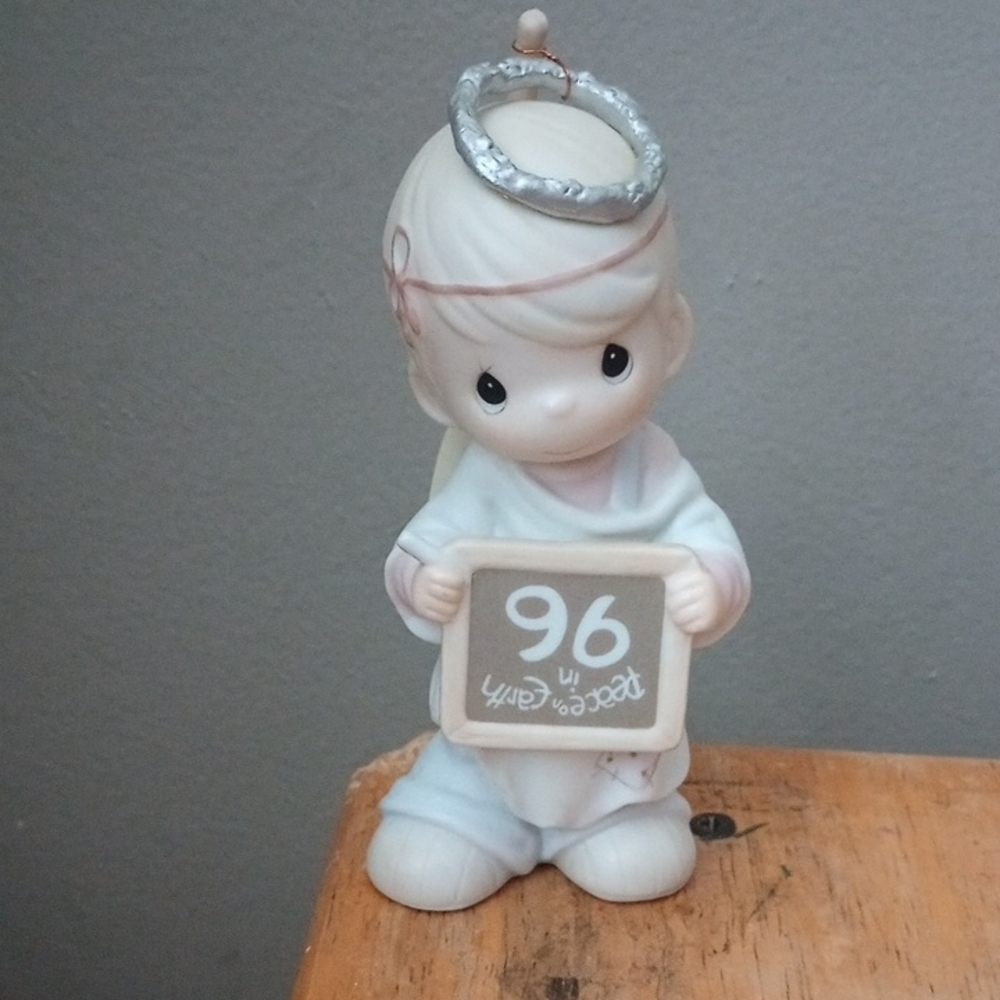 Precious Moments Peace On earth... Anyway. White and Silver Ceramic Figurine